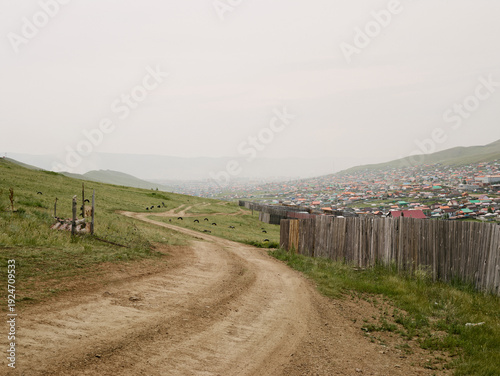 Countryside road at the edge of a growing city