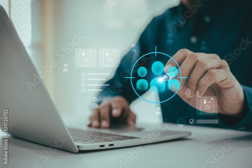 Foto Businessman use  with a digital screen  laptop, customer relationship management (CRM) interface, symbolizing targeted customer analysis and data-driven marketing strategy