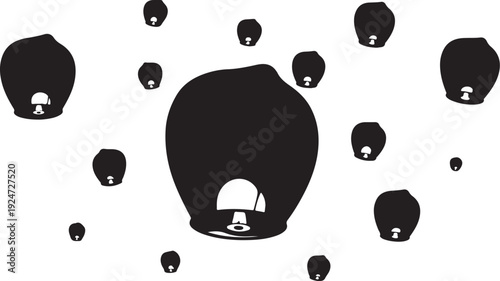 Black and white hot air balloons floating in sky