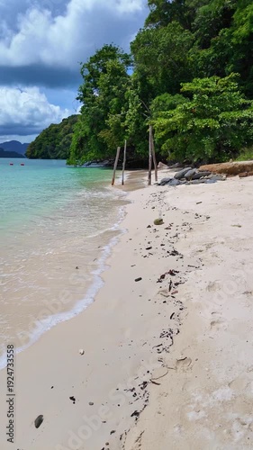 Walking along a pristine tropical beach on a bright summer day, with soft white sand, gentle waves, and clear turquoise water creating a calm and relaxing paradise atmosphere.