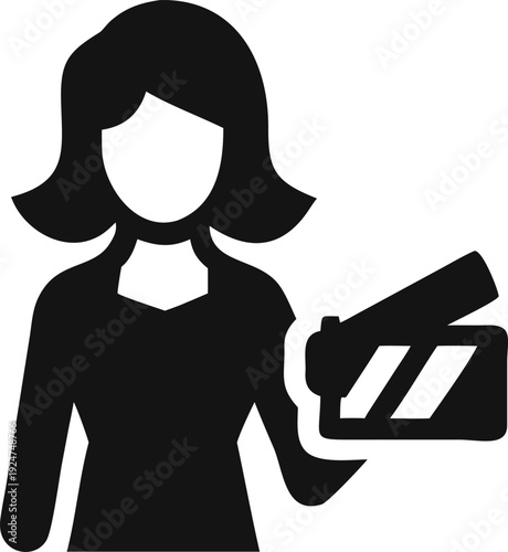 Creative woman involved in film production holding a traditional movie clapperboard