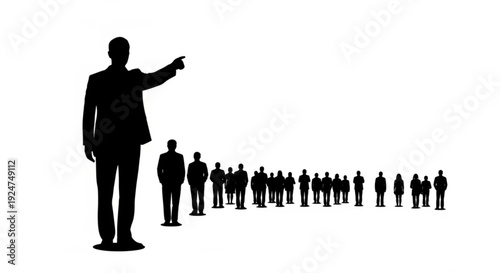 Silhouette of a man in a business suit pointing ahead of a group of people