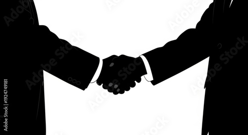Two businessmen shaking hands in a symbolic gesture of agreement