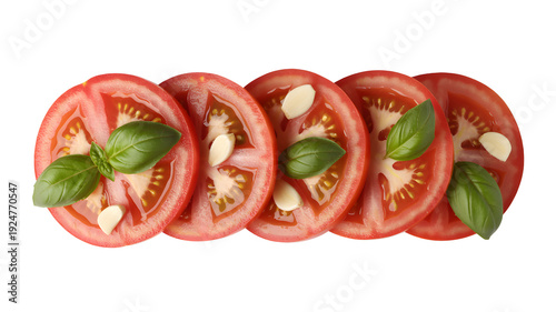 Sliced tomatoes with basil and garlic on a white background