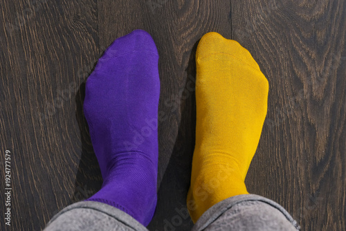 Cuadro en lienzo Top view mismatched purple and yellow socks, anti bullying awareness, embrace di