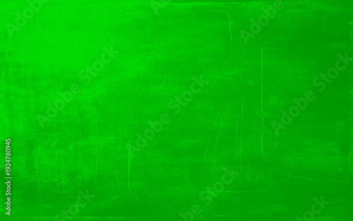 Green grunge texture with vintage surface and distressed concrete background. Green wide grunge effect texture. 