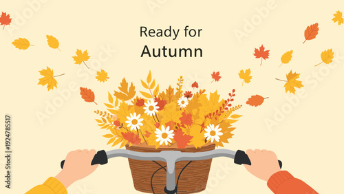 Close-up view of a bicycle basket filled with a bouquet of colorful autumn leaves and white flowers in the fall.