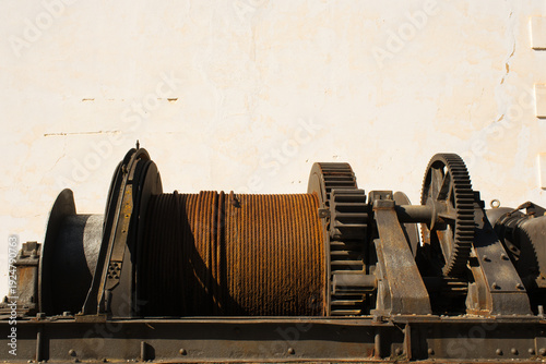 Old mining gears used to pull a steel cable.