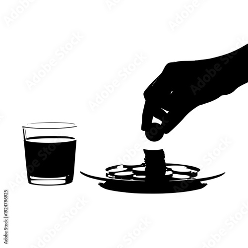 A hand pouring liquid from a spoon into a glass on a saucer