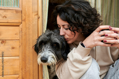 Canvas Print Woman cuddling lovable scruffy dog creating bond of affection