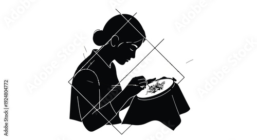 Focused woman meticulously embroiders intricate design on fabric hoop