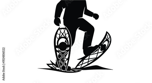 Silhouette of a person snowshoeing through a snowy landscape