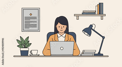 Woman working on laptop at modern office desk