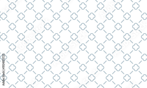 スペースの空いたクローバーマークのフレームから広がるひし形の格子柄