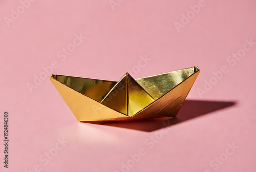 Wallpaper Mural Paper boat origami sculpture made from shiny gold foil on soft pink background, minimalist studio still life with copy space, childhood play and travel concept Torontodigital.ca