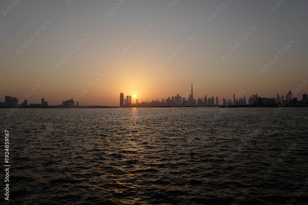 Fototapeta premium Creek Harbour sunset, Dubai Promenade, skyline, Burj Khalifa