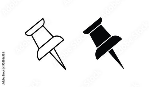 Two push pins in black and white on a for office or organizational use