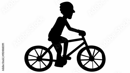 Silhouette of child riding bicycle with helmet on