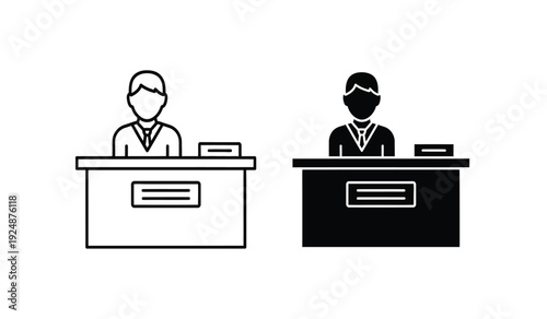 Two business people sitting at desks with computers