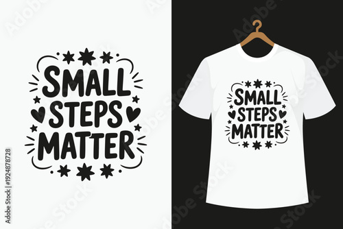 White T- Shirt with Black Small Steps Matter Hanging on a Wooden Hanger white t-shirt black text stars