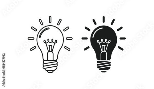 Black and white light bulb icons with rays on a pure for concepts of ideas and inspiration