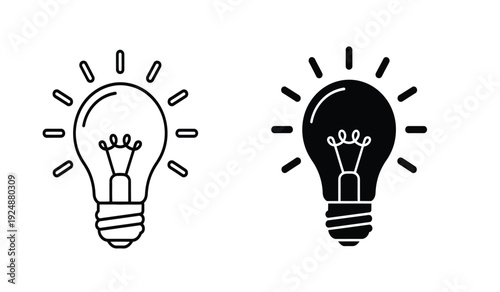 Black and white light bulb icons with rays on isolated for business or creative concepts