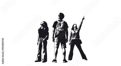 Three people, two women and one man, stand together looking upwards, with one woman pointing.