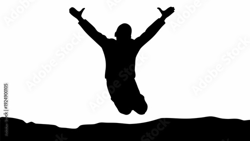 Man jumping in air with arms outstretched in triumph