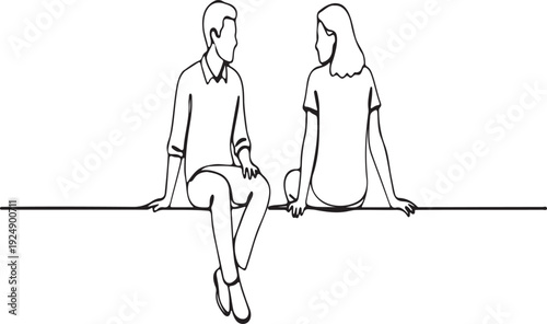 Young man and woman sitting together, looking at each other.