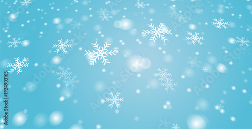 Falling snowflakes and soft bokeh lights on a light blue gradient background. Winter holiday vector illustration with a sense of perspective and depth.