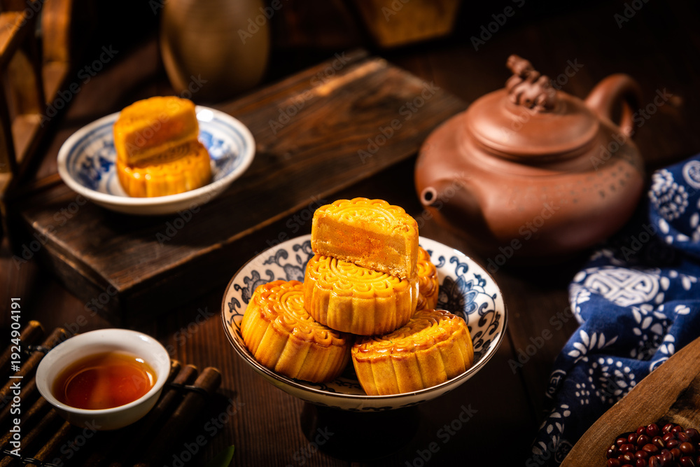 Fototapeta premium Mid-Autumn Festival Mooncakes with Traditional Tea Service