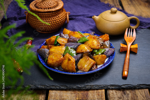 Canvas Print Asian Stir-Fried Potatoes and Eggplant with Teapot