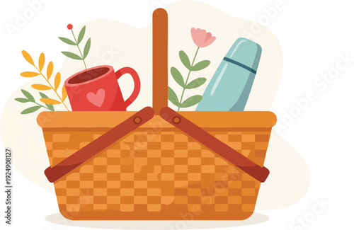 Cozy picnic basket filled with thermos mug and autumn leaves ready for outdoor leisure and relaxation activities