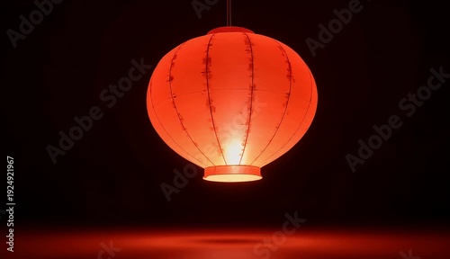 Vibrant red traditional paper lantern glowing softly in a dark setting, casting a warm reflection below, symbolizing celebration and cultural heritage