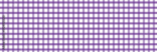 Purple gingham pattern with classic check lines. Summer textile background. Purple and white check grid texture.