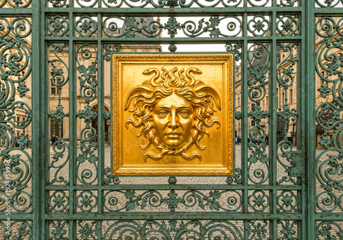 Golden Medusa Head on Ornate Gate