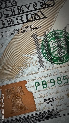 Macro view of dollar banknotes. Animation of detailed close up One hundred USD bill. Concept of finance, business, economy, investment. Vertical stock footage for phone