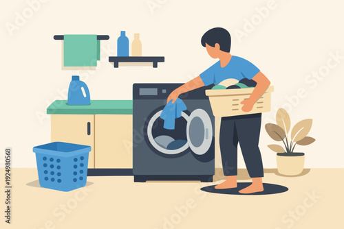 Man doing laundry, loading washing machine with clothes from a basket
