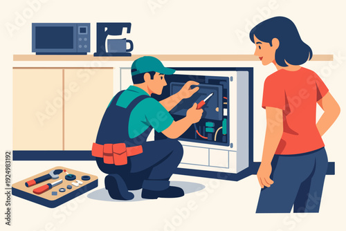 Technician repairing kitchen appliance while customer observes, professional service at home