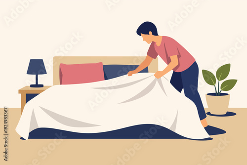Man making bed in bedroom, doing daily household chores and routine work