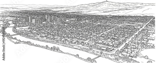 Aerial view of a sprawling city with a river and distant mountains