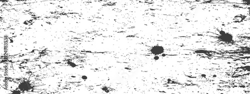 Grungy black and white distressed texture with ink splatters and scratches for graphic design