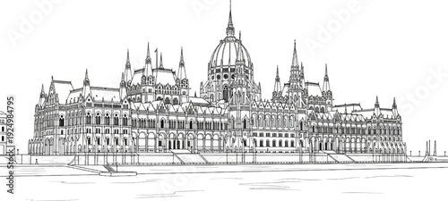 Elaborate Gothic architecture of a grand building on a riverbank