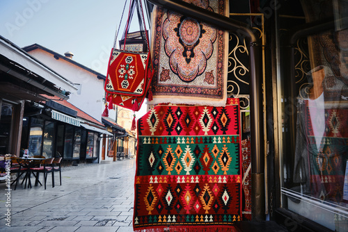 Colorful traditional bosnian carpets hanging outside a shop in a historic old town district Bascarsija, Sarajevo, Bosnia and Herzegovina