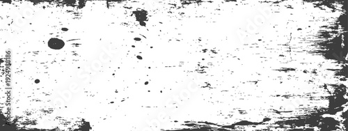Abstract Grunge Distressed Texture with Paint Splatters and Rough Frame in Black and White