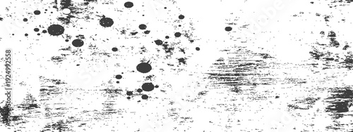 Abstract black and white grunge texture with ink splatters and scratched distress effect