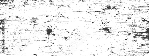 Distressed black and white grunge texture with ink splatters and scratches a rough vintage monochrome background overlay effect