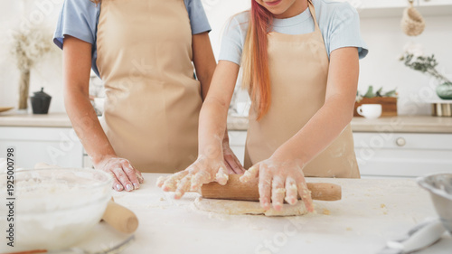Bilde på lerret People prepare dough together in a kitchen