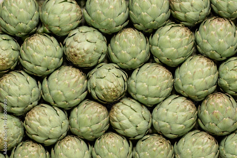 Obraz premium Fresh artichokes flat lay macro texture top view.