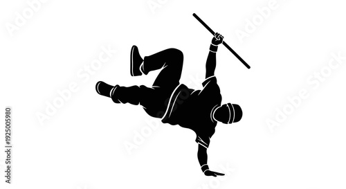 A person performing a breakdancing move with a stick in hand.